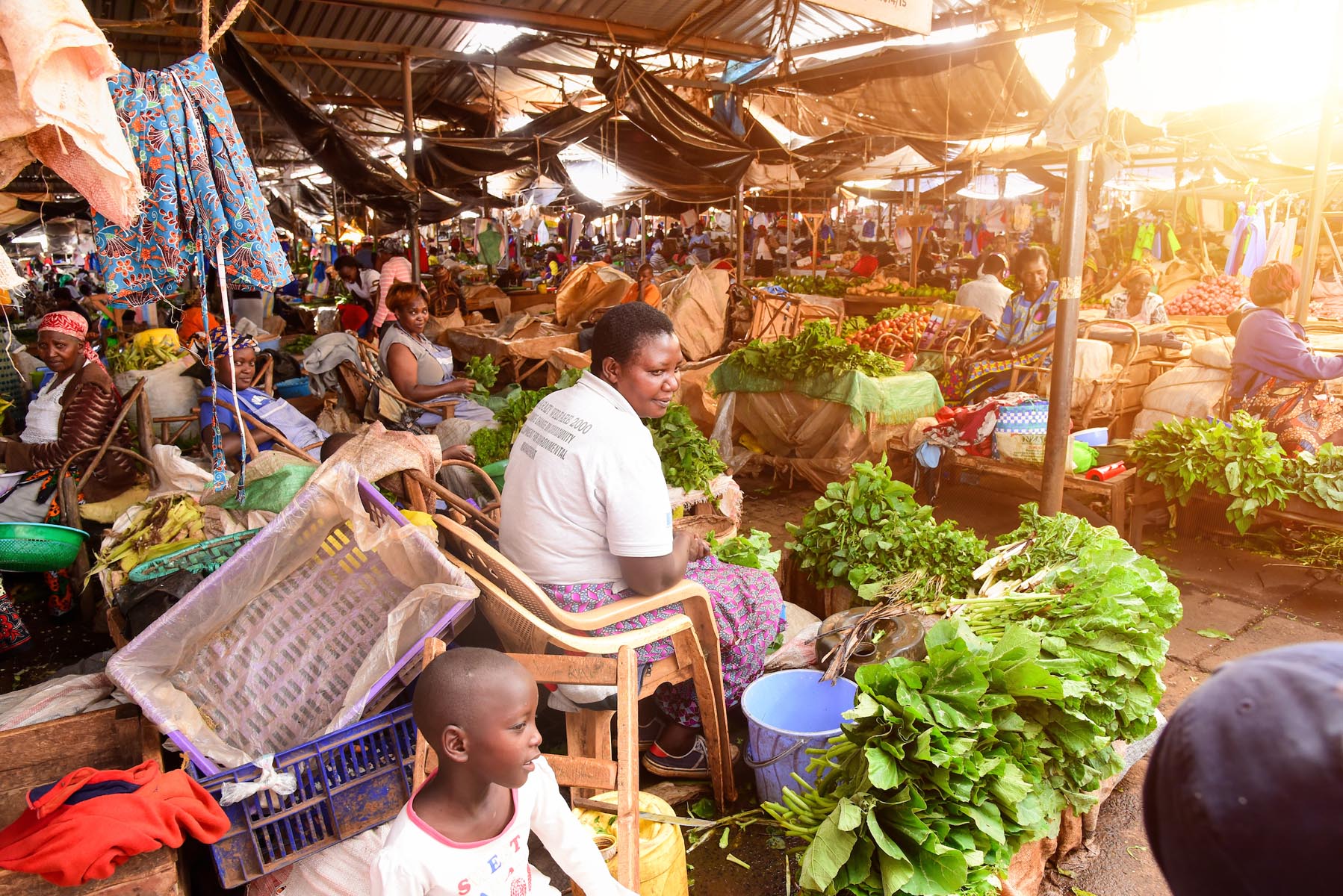 Local vendors selling vegetables at a market in Kenya,Africa